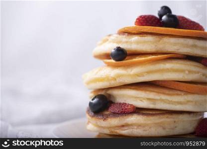 Stack of homemade thin pancakes or crepes