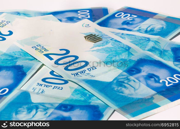 Stack of Israeli money bills of 200 shekel.