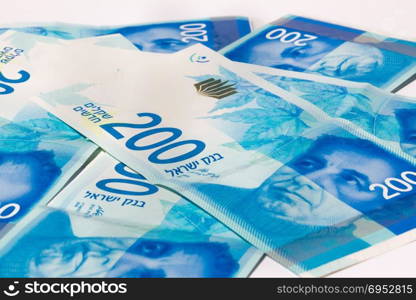 Stack of Israeli money bills of 200 shekel.