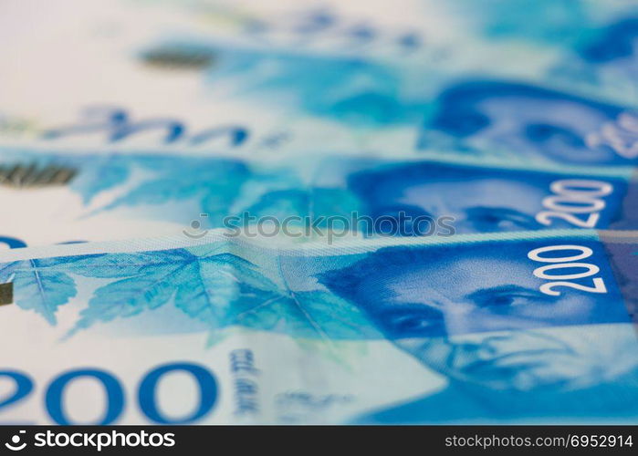 Stack of Israeli money bills of 200 shekel.