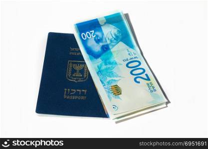 Stack of israeli money bills of 200 shekel and israeli passport - Top view.