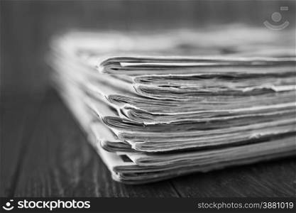 stack of magazines on the wooden table