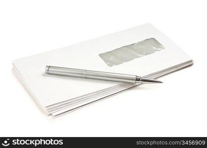 stack of mail envelopes and a pen isolated on white background