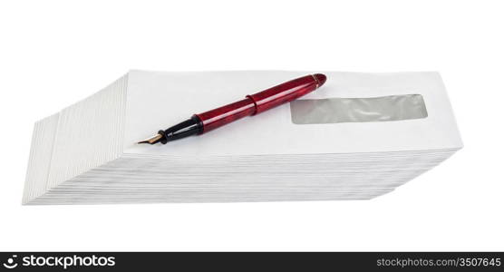 stack of mail envelopes and a pen isolated on white background