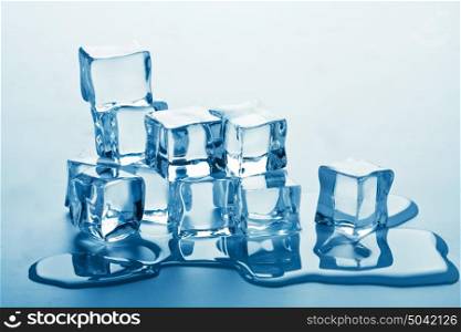 stack of melting ice cubes