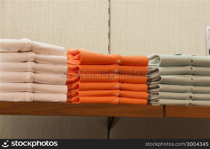 stack of neatly folded shirts