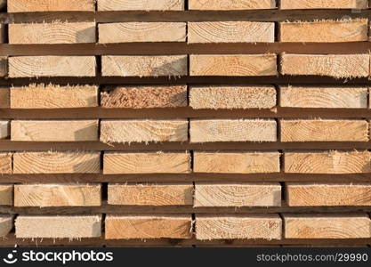 Stack of new wooden studs at the lumber yard