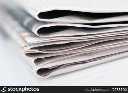 Stack of newspapers. A photo close up. Selective focus