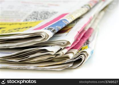 Stack of newspapers isolated on white background