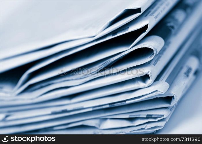 stack of newspapers toned blue