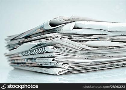 Stack of newspapers. Toned in blue.