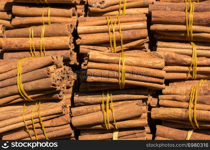 Stack of of Cinnamon sticks in view as background