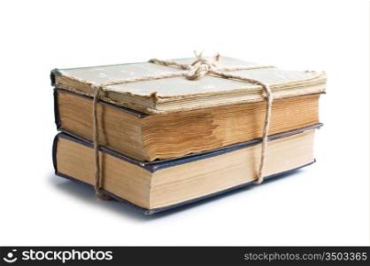 stack of old books tied with rope isolated on white