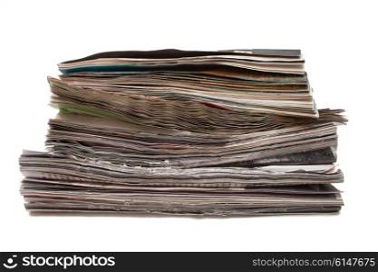 Stack of old magazines spoiled isolated on white background
