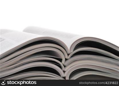 Stack of open magazines isolated on white background. Magazines