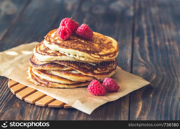 Stack of pancakes with fresh raspberries close-up