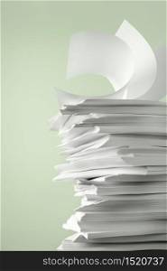Stack of Papers against a plain color background
