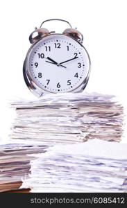 Stack of papers and clock isolated on white