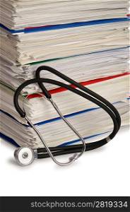Stack of papers with stethoscope