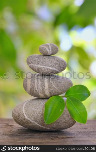 Stack of pebble on old wood