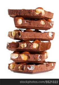 stack of pieces of chocolate with nuts on white background