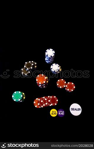 Stack of poker chips on black background