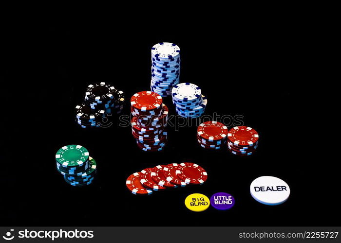 Stack of poker chips on black background