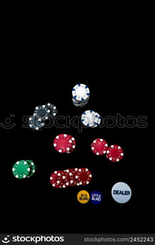 Stack of poker chips on black background