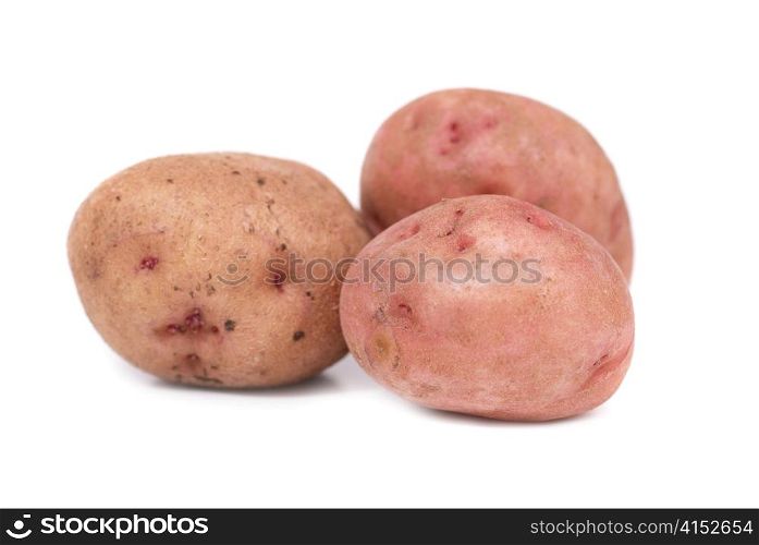 Stack of potatoes isolated on white background