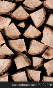 Stack of rough chopped and sawn timber closeup