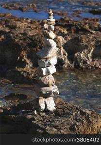 Stack of round stones on a seashore
