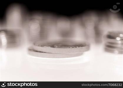 Stack of silver coins macro. Rows of coins for finance and banking concept. Economy trends background for business idea and all art work design. Closeup, Shallow depth of field.. Stack of silver coins macro. Rows of coins for finance and banking concept. Trade in precious metals