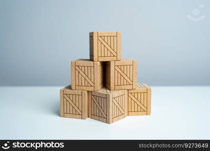 Stack of stacked wooden crates, pyramid of boxes. Order for shipment. Production and freight of goods. Increase in imports and exports, economic recovery.