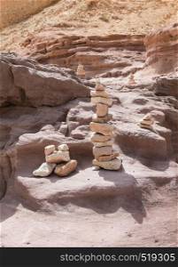 stack of stones in the red canyon in israel. stack of stones in the red canyon