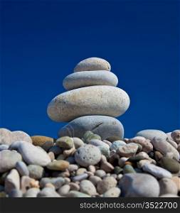 Stack of stones over blue sky background