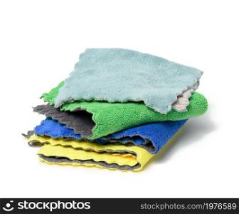 stack of textile multicolored rags for cleaning on a white background