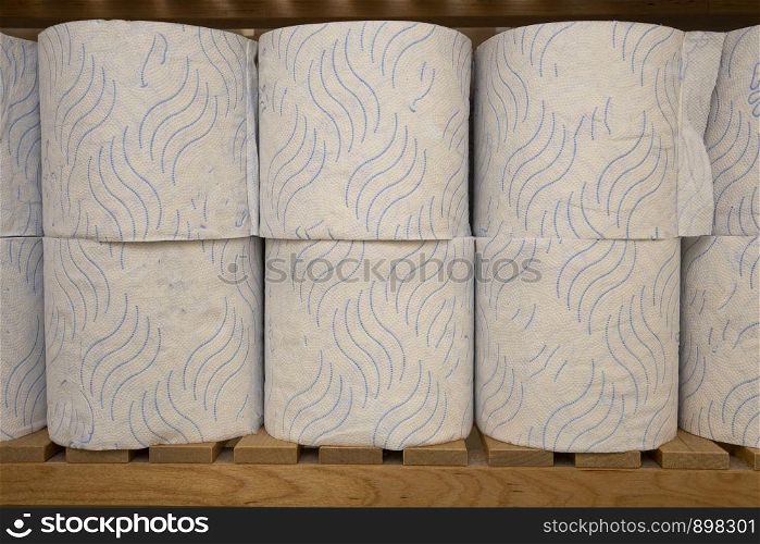 Stack of toilet paper, storage of toilet roll in the closet in a row. Stack of toilet paper, storage of toilet roll in the closet
