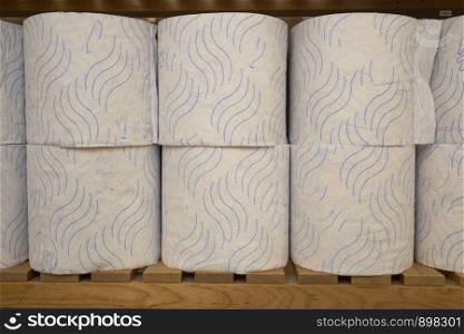 Stack of toilet paper, storage of toilet roll in the closet in a row. Stack of toilet paper, storage of toilet roll in the closet