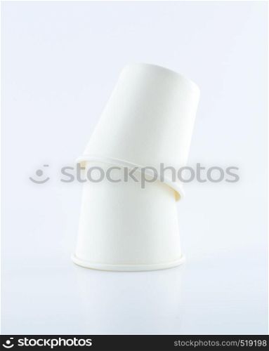 Stack of Two paper cups upside-down on white background