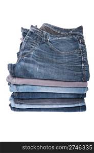 stack of various jeans isolated on white background