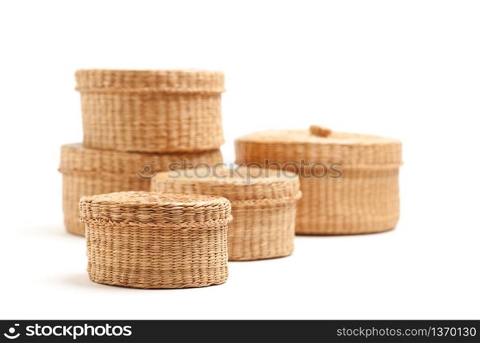 Stack of Various Sized Wicker Baskets Isolated on White.