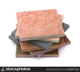 Stack of various stone tiles isolated on white