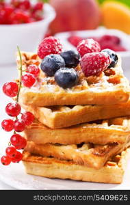 stack of waffles with berries