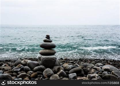 stack of zen stones pyramid on beach