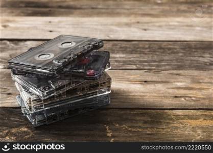 stack transparent cassette tapes wooden background