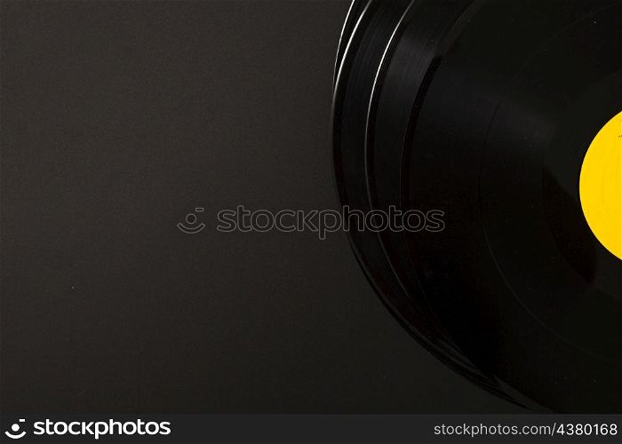 stack vinyl record black background