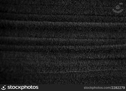 stacked black bathroom towels background. spa salon, barbershop.. stacked black bathroom towels background. spa salon, barbershop