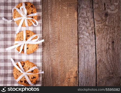 Stacked chocolate chip cookies on wooden table
