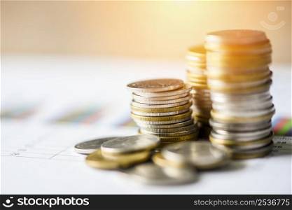 stacked coins financial and business man on business graph paper analysis of business investment concept money