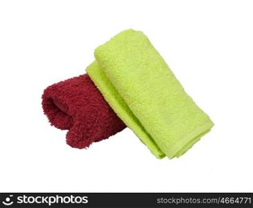 Stacked colorful towels isolated on white background